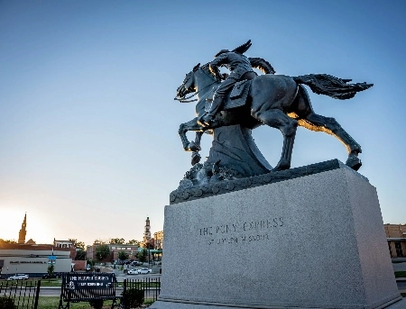 Pony Express Museum sign with a horse and rider.