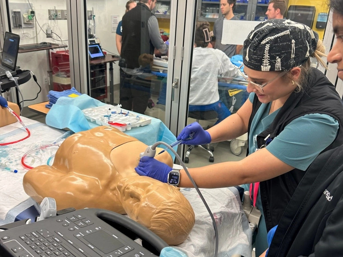 A medical student practicing in the simulation center.