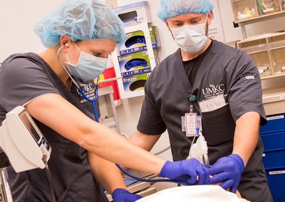 Two MSA students practice their skills in the simulation lab.