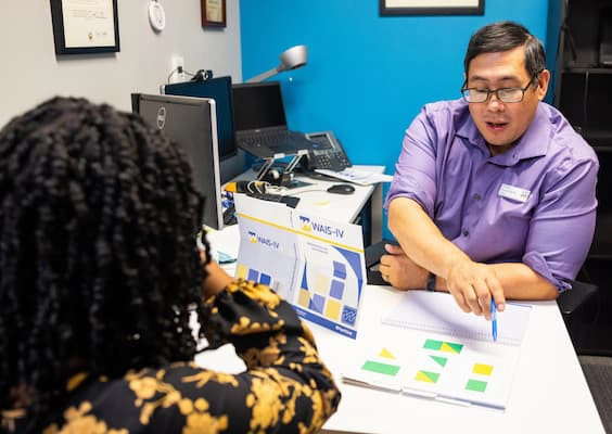 A students talks with an advisor about their accessibility needs.