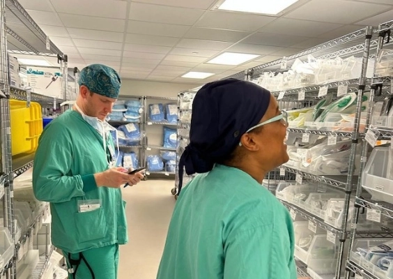 Two anesthesiology residents in the stock room looking for supplies. 