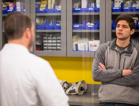 A faculty member and student talking in one of the School's labs.