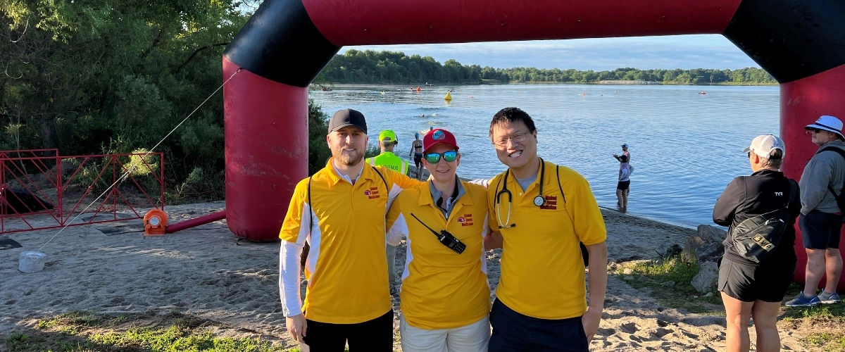 Sports medicine fellows pose for a photo at a race event.