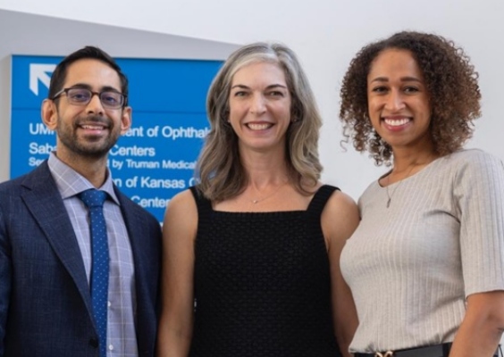 Dermatology residency program leaders smiling for a group photo. 