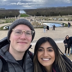 Grant and woman with the Versailles garden in the background