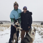 Austin with fiancé and their two dogs outside on a snowy day