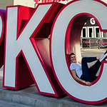 Brenda posing in the C of a I heart KC sign