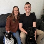 Portrait of Braden Zoller with his wife and their dogs.