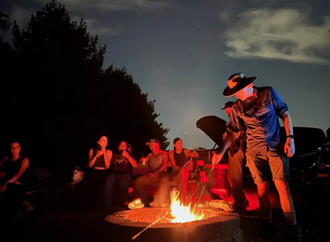 residents at evening campfire