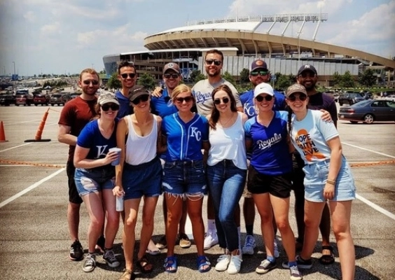 Emergency Medicine residents hang out during a tailgate at Kauffman stadium.