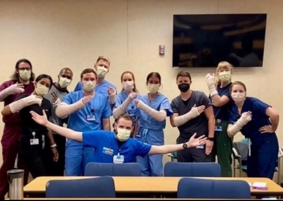 Emergency Medicine residents pose for a fun group photo after a cast making workshop.