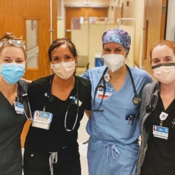 The Emergency Medicine residency director and three residents pose for a group photo at University Health Truman Medical Center. 