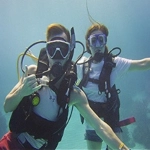 Portrait of Joey Obrien and his wife scuba diving.