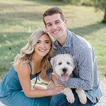 Portrait of Kameron Hartung with his wife and their dog.