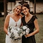 Portrait of Paige Swan as a bridesmaid posing with the bride.