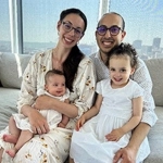 Portrait of Zoe Durand with her husband and children.