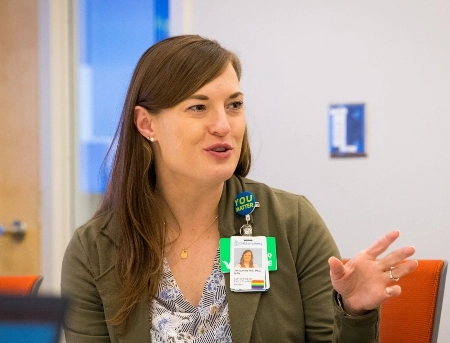 Two faculty members speaking at a faculty event.