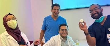 Four IM residents smiling and laughing.