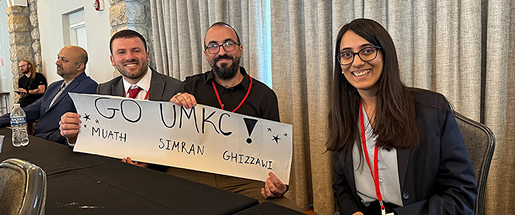 three-people-holding-banner