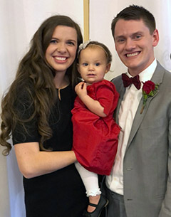 Janelle Fried with her husband and daughter.