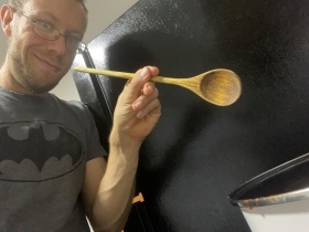 Phil Jurasinksi making food in the kitchen.