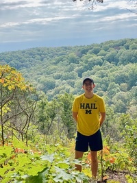 Anthony McKeiver smiling during a trail hike.