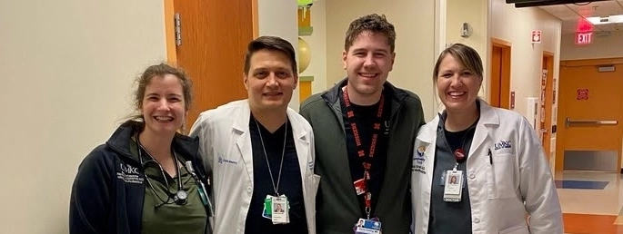 MedPeds residents in their white coats on Hospital Hill.