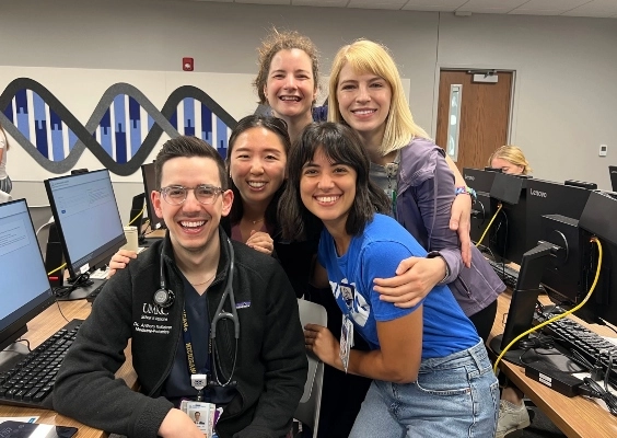 Medicine Pediatrics residents smile while posing for a photo.