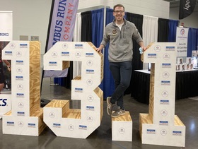 Phillip Wozniak smiling during an event.