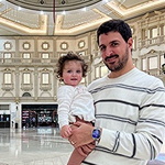 Yazan and child inside a large domed room