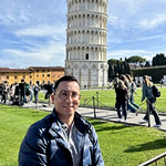 Francisco standing with the Tower of Piza in the background