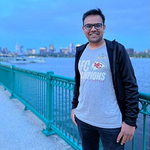 Himil on bridge with water and skyline in the background