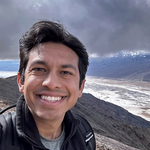 Sagar with sky and coastline behind him