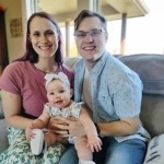 Portrait of Kendra Garetson, OBGYN resident, with her daughter and partner.