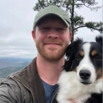 Portrait of Sawyer Hickey, OBGYN resident, with his dog.