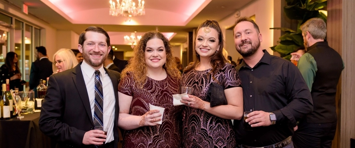 OBGYN fellows posing for a photo at a fancy event.