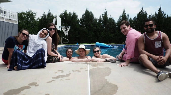 OBGYN residents posing for a group photo at someone's pool.