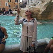 Portrait of Kirstyn Powell, OBGYN resident, in front of Trevi Fountain in Rome.