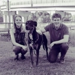 Portrait of Mason Sifford, OBGYN resident, with his partner and his dog.