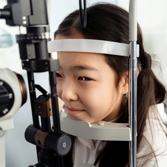 Close up of a young patient getting an eye exam.