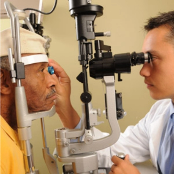 An ophthalmologist performing an eye exam. 