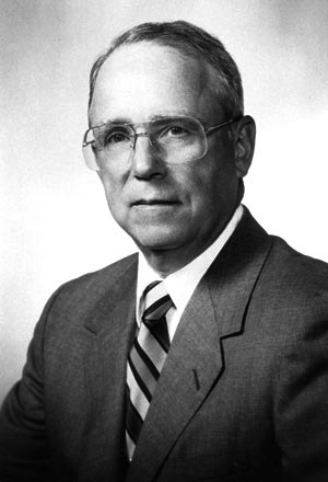 Portrait of Dr. Richard H. Kiene in a suit and tie.