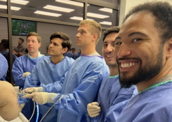 Orthopaedic surgery residents practicing a procedure in the operating room.