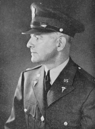 Portrait of Rex L. Diveley dressed in his U.S. Army uniform and cap.