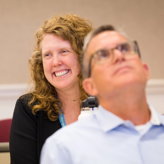 A School of Medicine faculty member smiling during a faculty event.