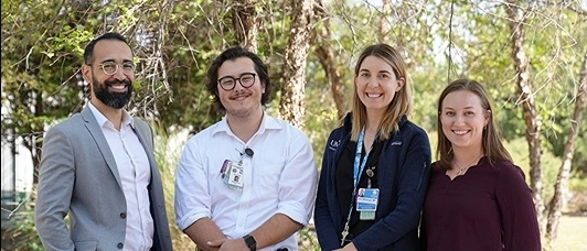 Psychiatry residents posing for a photo and smiling.