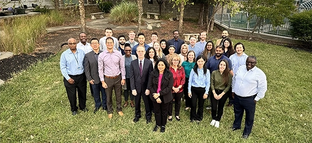 Looking down on psychiatry department residents and faculty posing for photo.