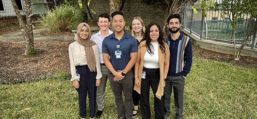 A small group of psychiatry resident standing and posing for photo.