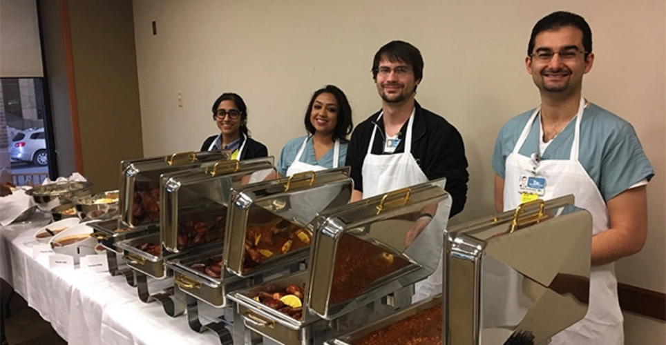 Radiology residents serving up food at the department Smoking Out Lung Cancer event. 