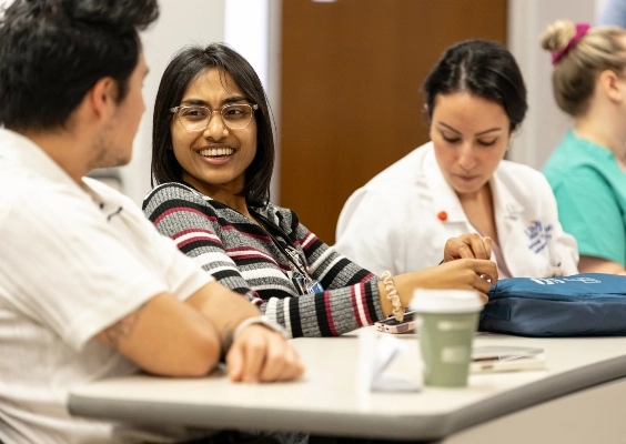 Student discussing a lecture during the residency program.